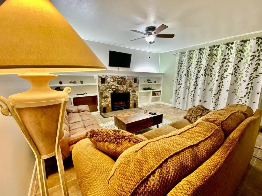 a living room with a couch and a fireplace at Home Sweet Home in Grass Valley in Grass Valley