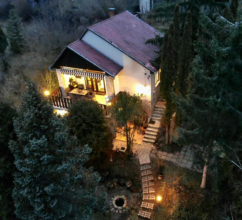 an aerial view of a house with lights at Égig Érő Fa Vendégház in Nógrád