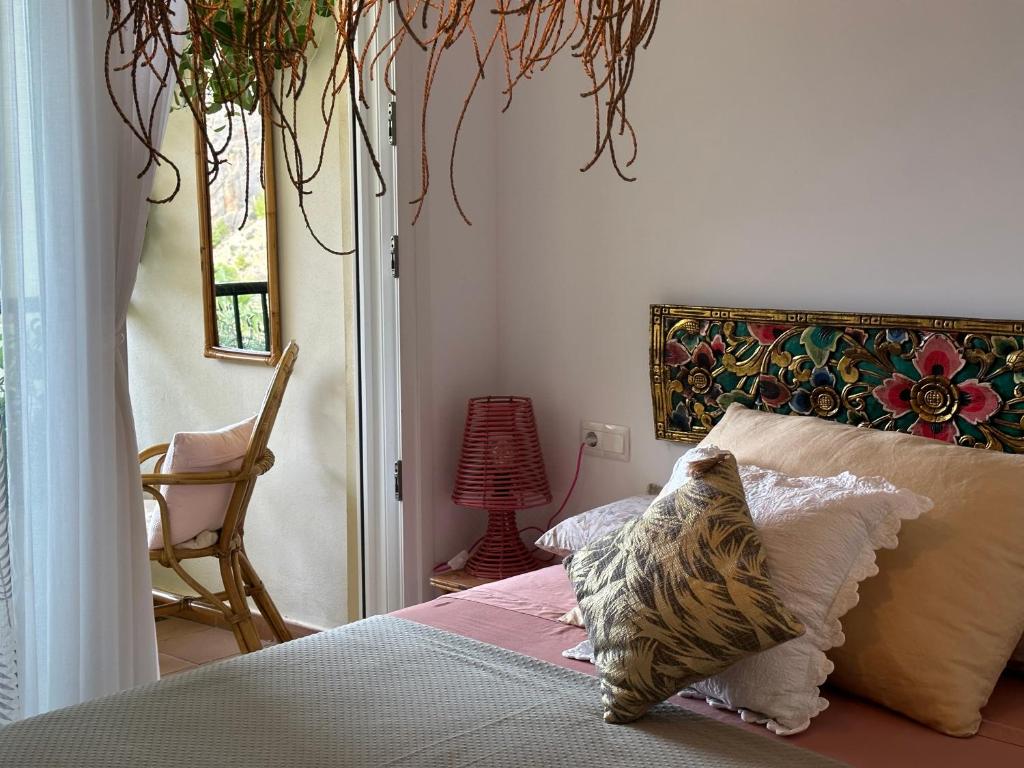 a bedroom with a bed with a pillow on it at Can Luc Altea in Altea