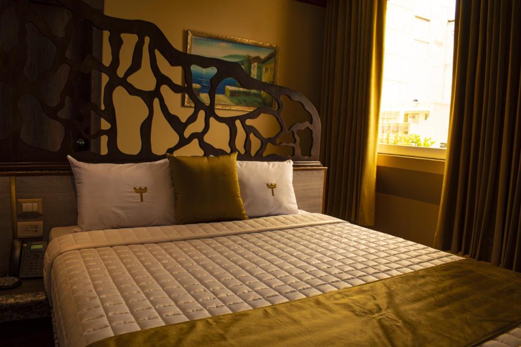 Postel nebo postele na pokoji v ubytování FORTICH APART HOTEL