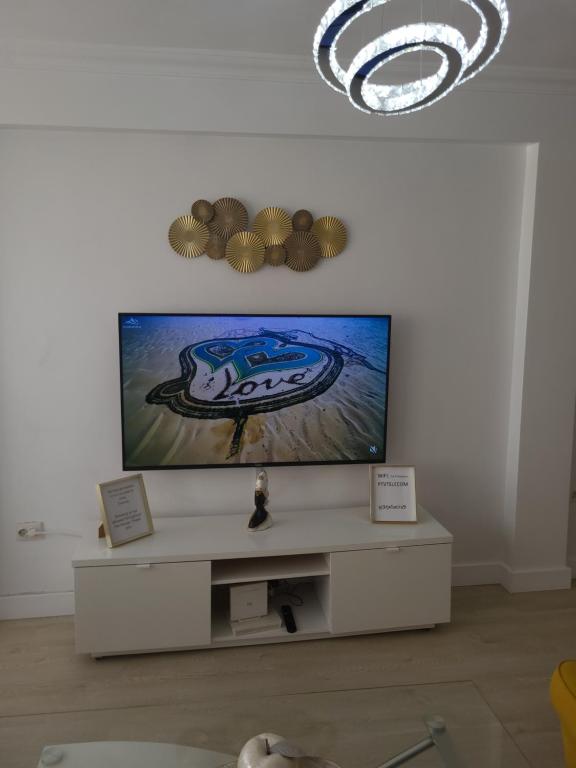 Televízia a/alebo spoločenská miestnosť v ubytovaní Appartement centre ville Malaga