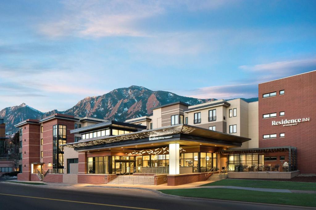 a rendering of a hotel with mountains in the background at Residence Inn by Marriott Boulder Canyon Boulevard in Boulder