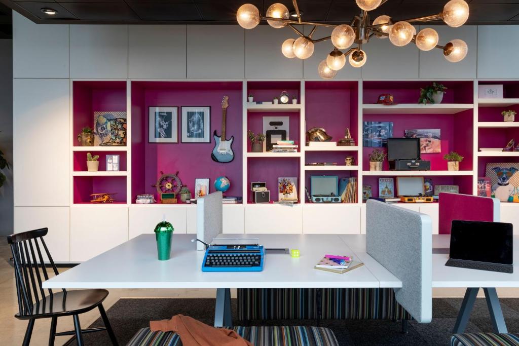 an office with a white desk with a computer on it at Moxy Aberdeen Airport in Dyce