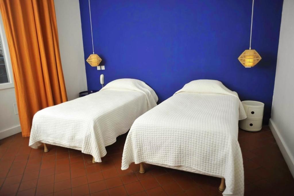 Postel nebo postele na pokoji v ubytování Hotel Burrhus