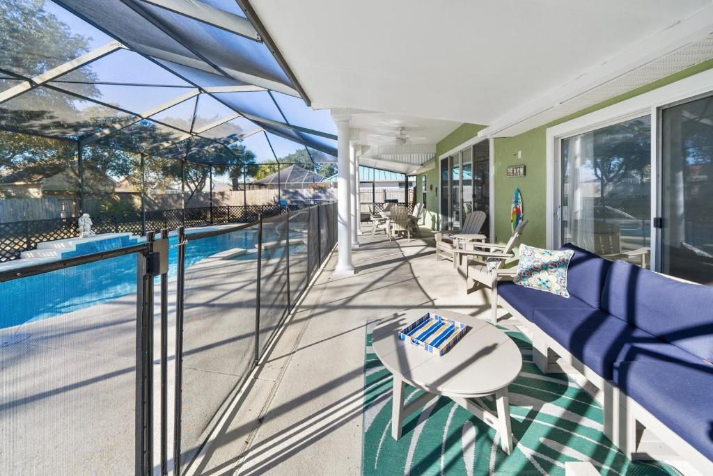 a balcony with a view of a swimming pool at Sea-renity Home in Sunnyside