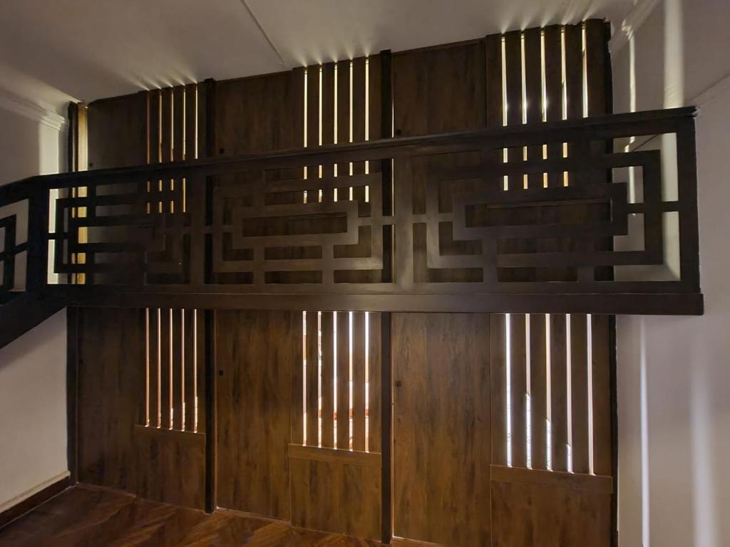 a bunk bed in a room with wooden walls at Cairo Hub in Cairo