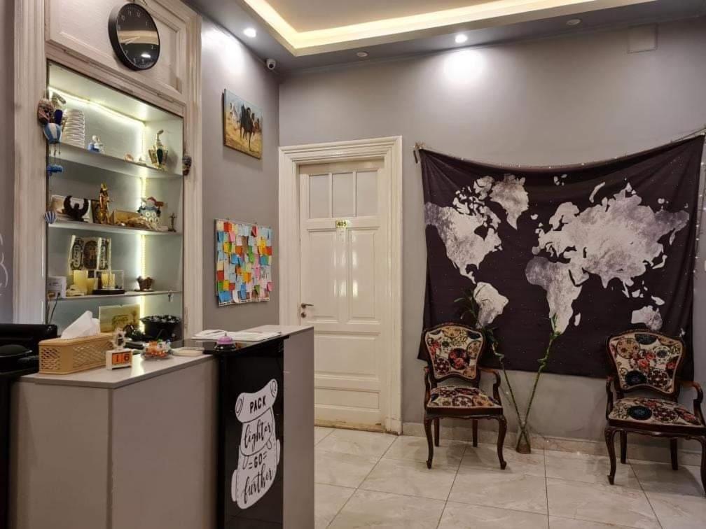 a room with a map of the world on the wall at Cairo Hub in Cairo