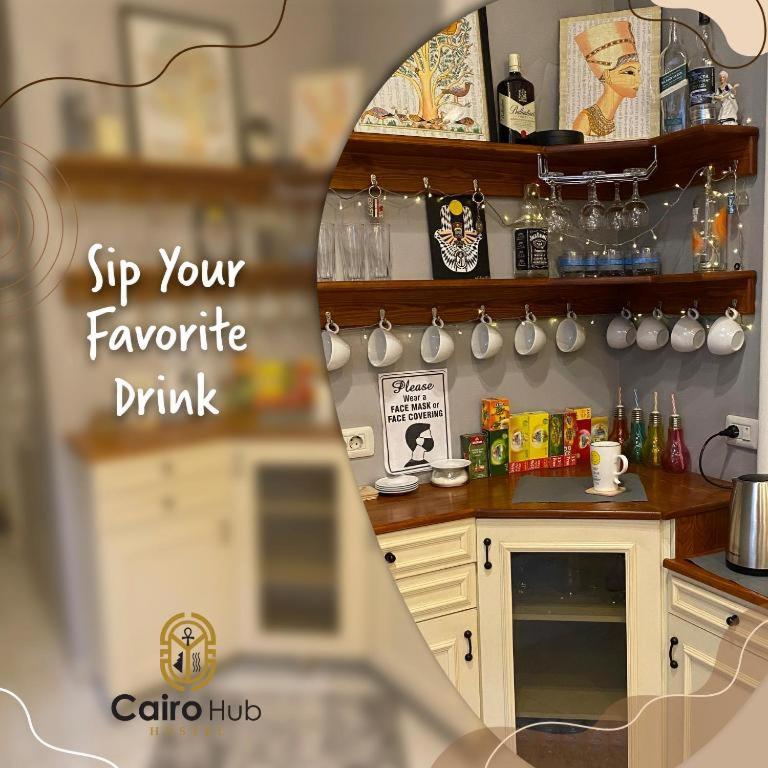 a kitchen with a table and a counter with a mirror at Cairo Hub in Cairo