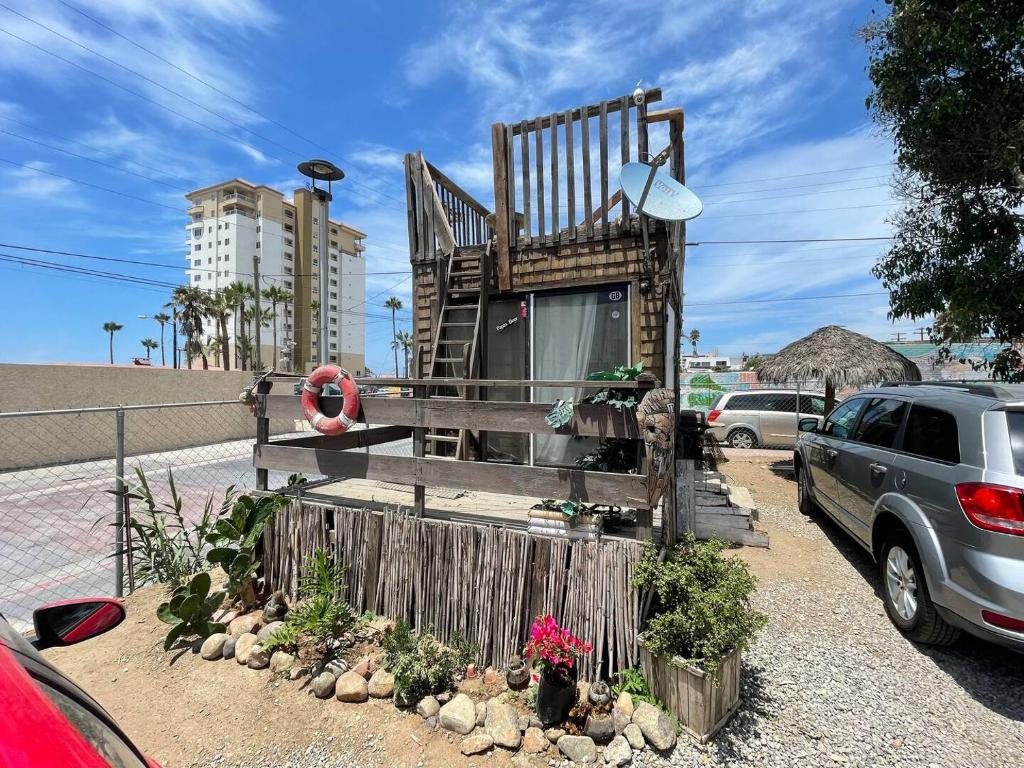 a chair sitting on the side of a parking lot at Beach Bungalow in Rosarito