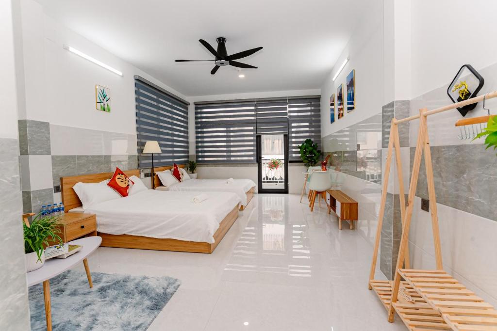 Postel nebo postele na pokoji v ubytování ALOHA SAIGON PREMIUM HOSTEL by Local Travel Experts - Newly opened, Less-touristy location, Spacious rooms, Glass shower bathroom, Free breakfast & Walking Tour