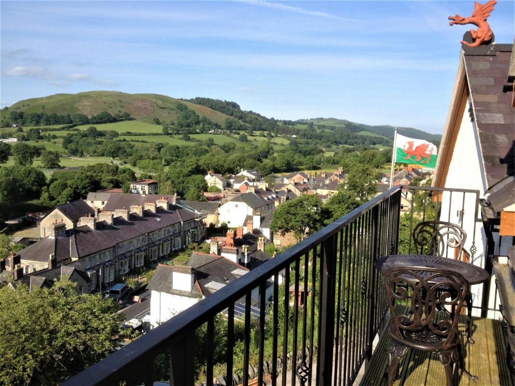 a balcony with a view of a town at 2 Bed in Corwen 77351 in Corwen