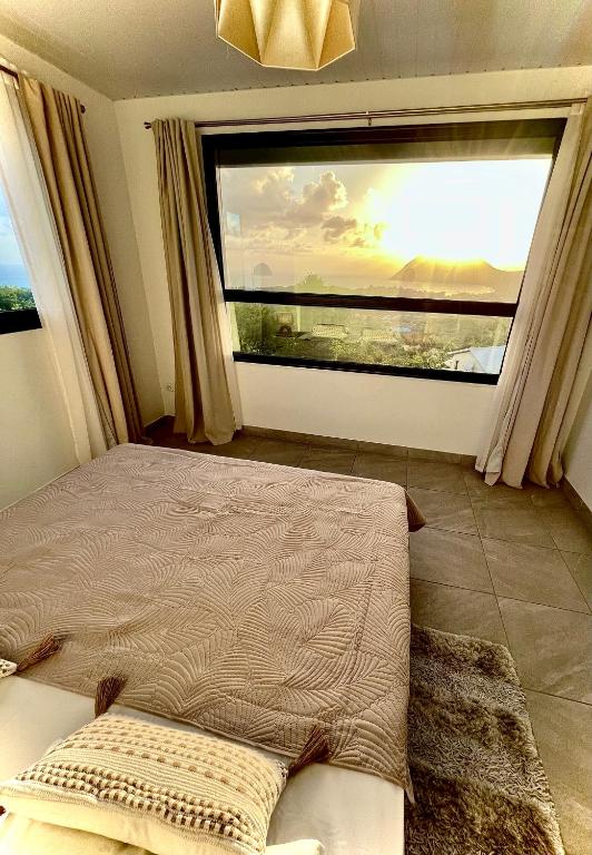 Postel nebo postele na pokoji v ubytování La villa O'rizon