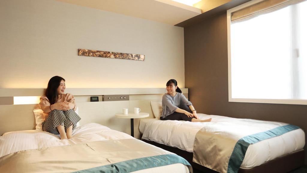 Postel nebo postele na pokoji v ubytování Urban Hotel Kyoto Shijo Premium