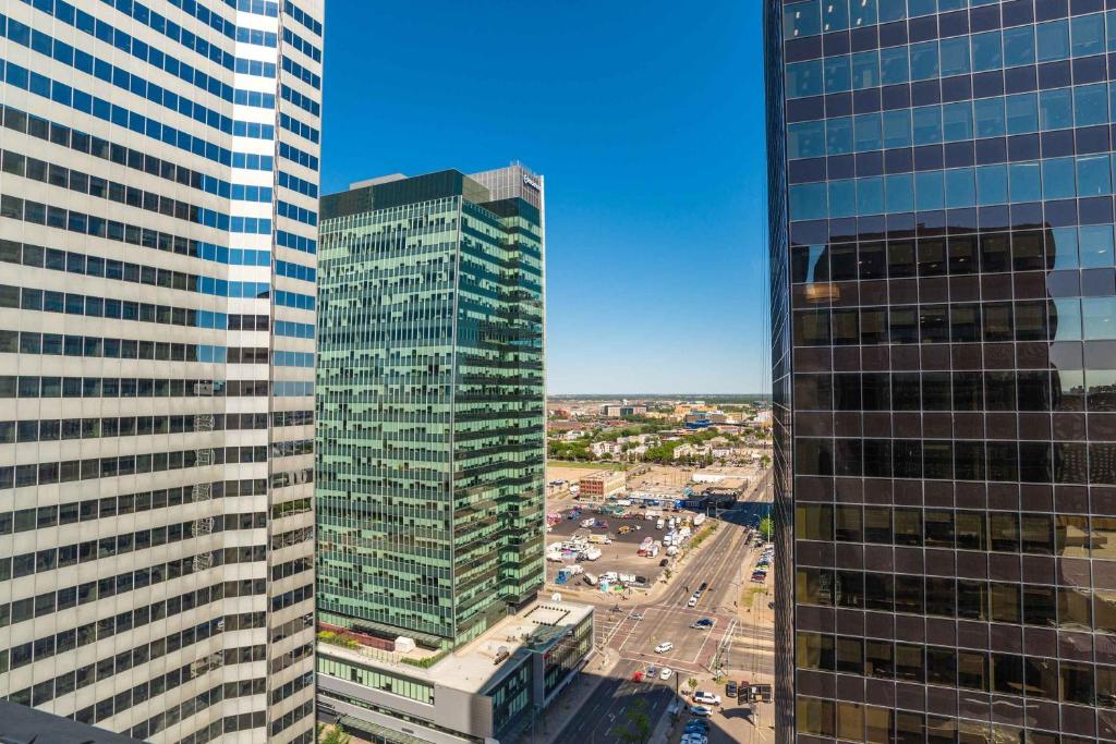 a view of two tall buildings in a city at Sandman Signature Edmonton Downtown Hotel in Edmonton