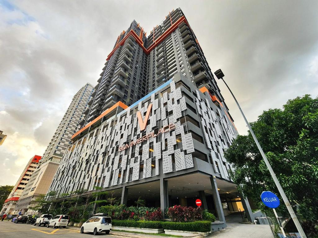 a large building with a sign on the side of it at Loft Suite Central City 2BR JB CIQ 7Pax in Johor Bahru