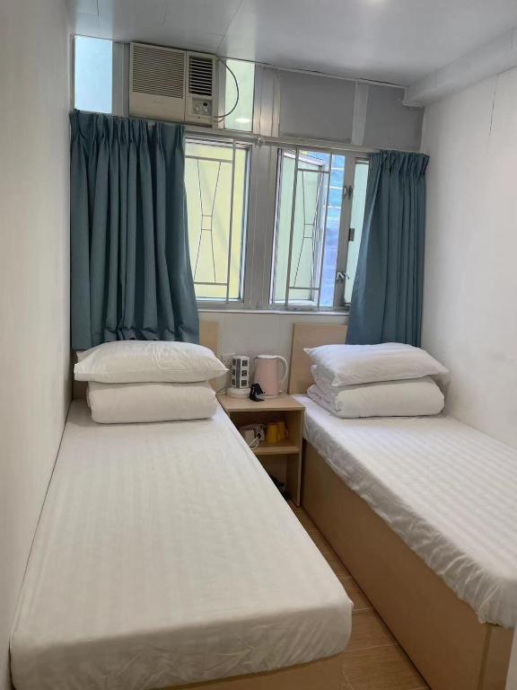 Postel nebo postele na pokoji v ubytování Timehouse Hong Kong Hostel Group
