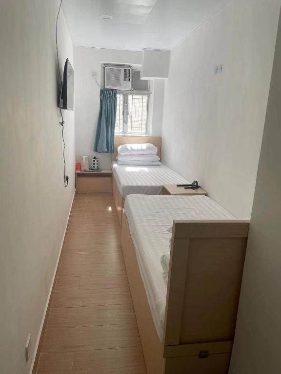 Postel nebo postele na pokoji v ubytování Timehouse Hong Kong Hostel Group