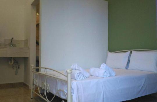 Postel nebo postele na pokoji v ubytování Markora Rooms