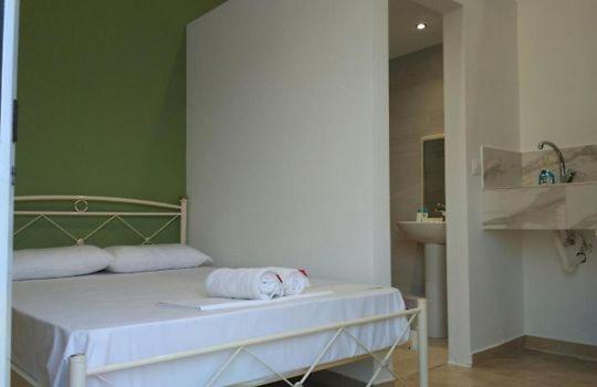 Postel nebo postele na pokoji v ubytování Markora Rooms