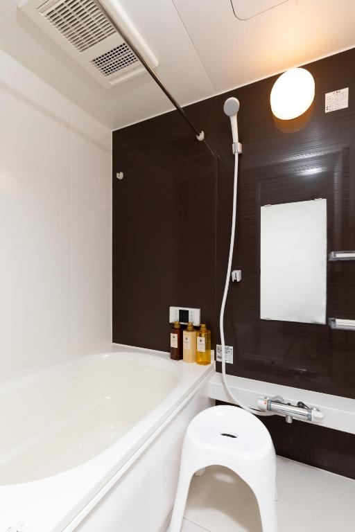 Ein Badezimmer in der Unterkunft Healing Inn Osaka Fukushima