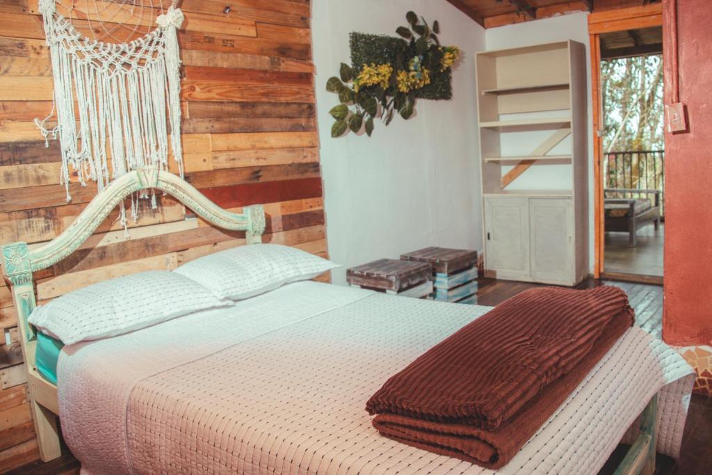 a bedroom with a swing bed in a room at flowers in Medellín