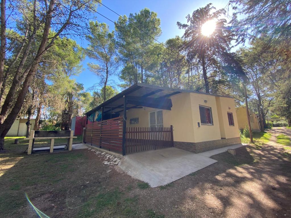 a small house with a gate and a fence at Cabaña Clarita La Florida in La Florida