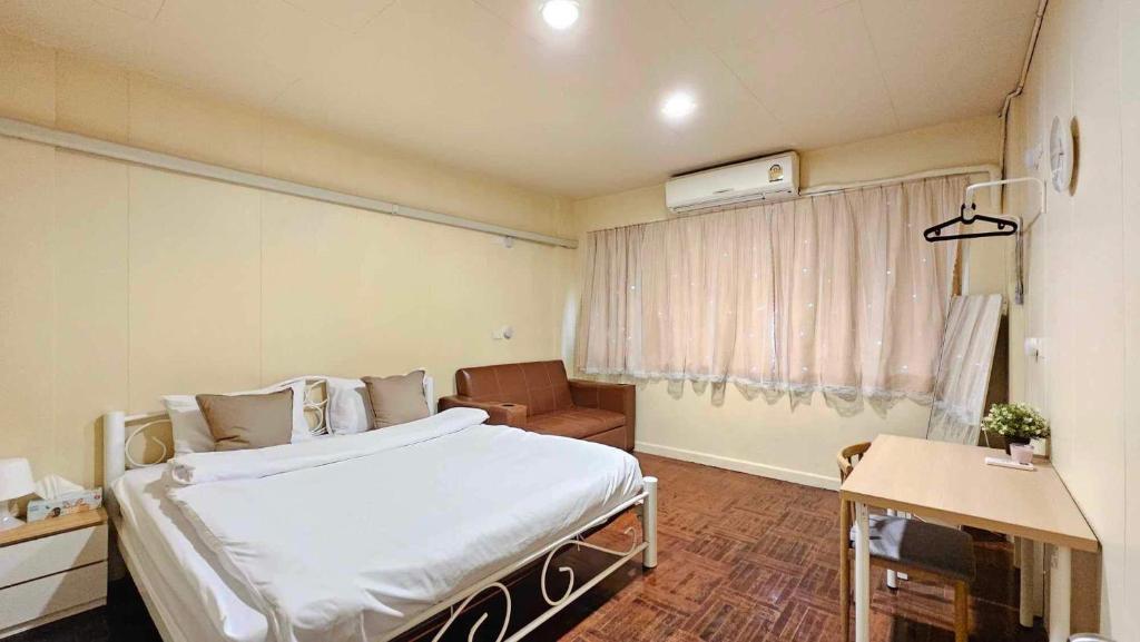 Katil atau katil-katil dalam bilik di W District Guesthouse