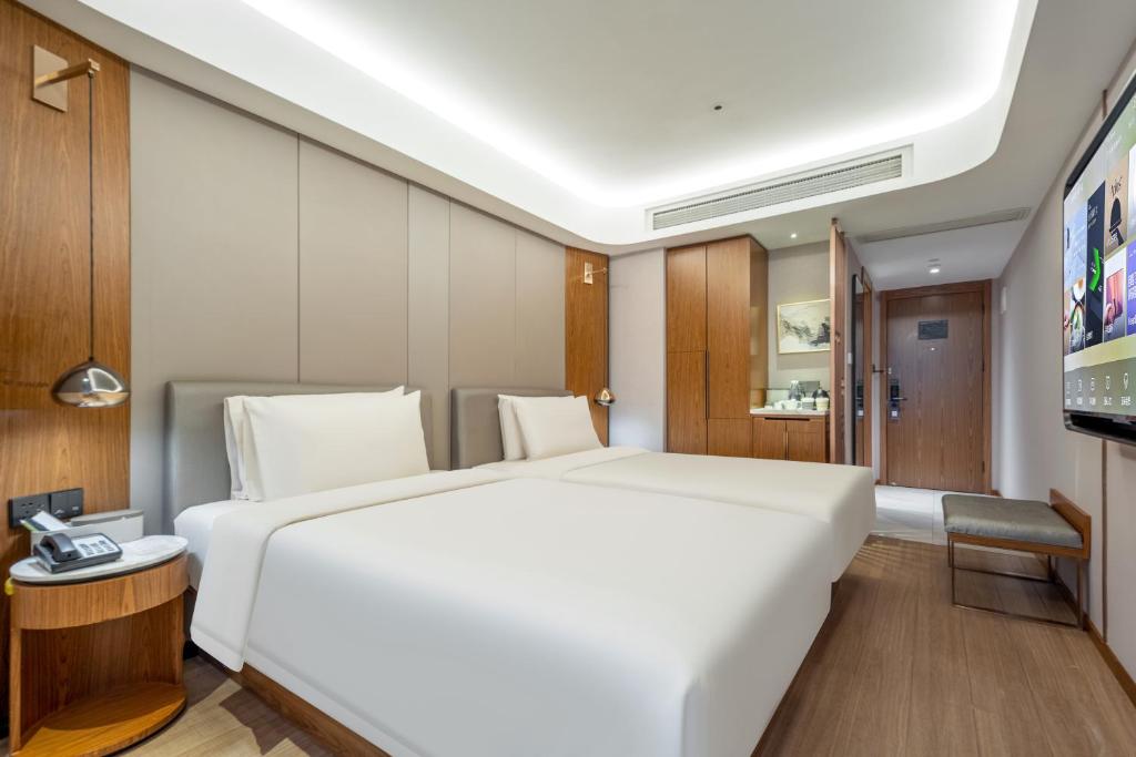 Postel nebo postele na pokoji v ubytování Atour X Hotel Shanghai Lujiazui Binjiang Avenue