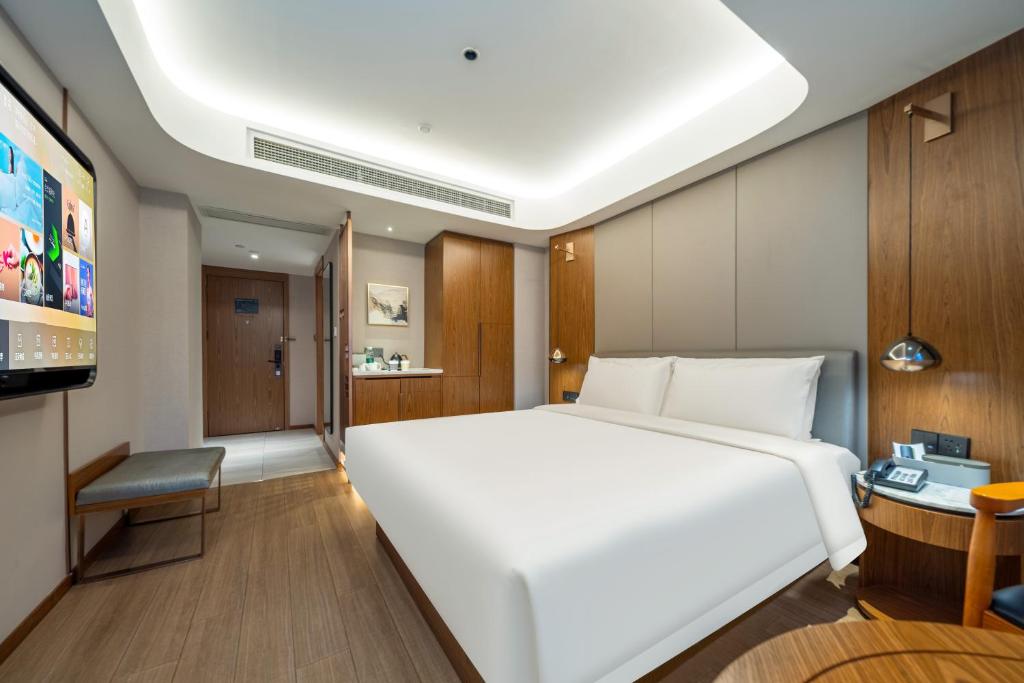 Postel nebo postele na pokoji v ubytování Atour X Hotel Shanghai Lujiazui Binjiang Avenue