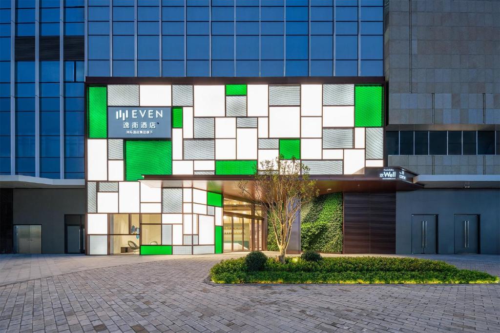 a building with green and white squares on it at EVEN Hotel Zhongshan City Center, an IHG Hotel in Zhongshan