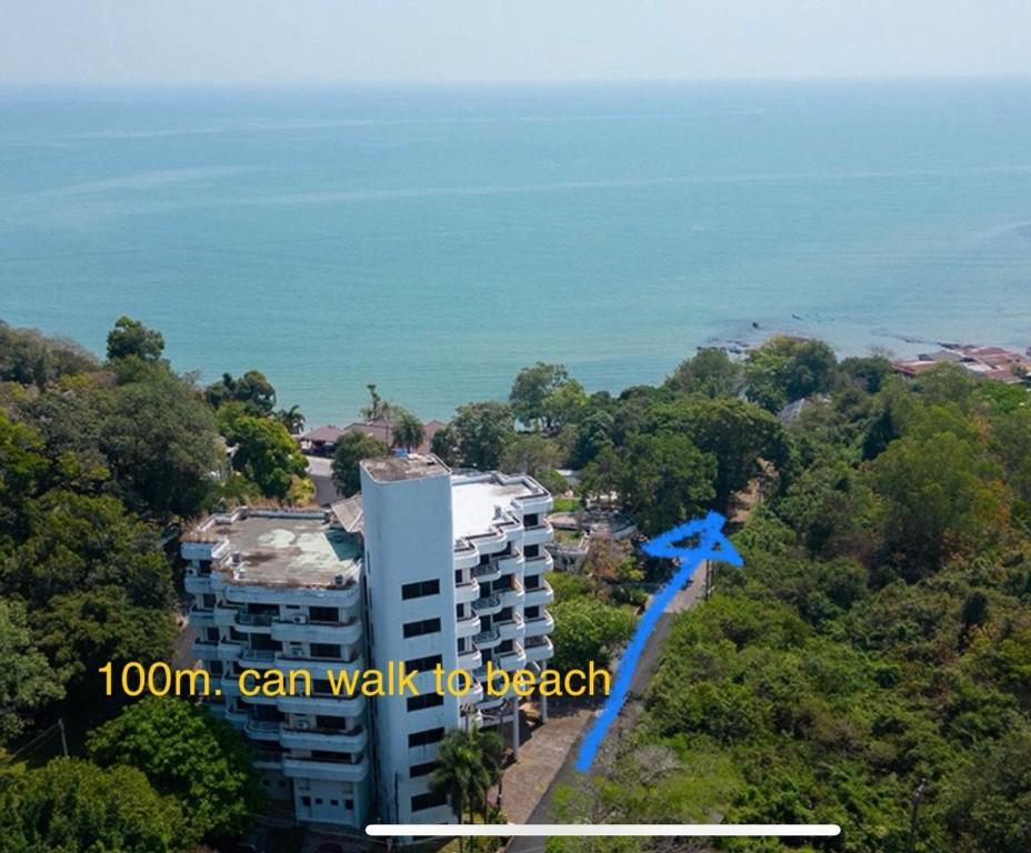 an aerial view of a building and the ocean at TRIPLET Suite Rayong Seaview Private Beach in Ban Ko Kok