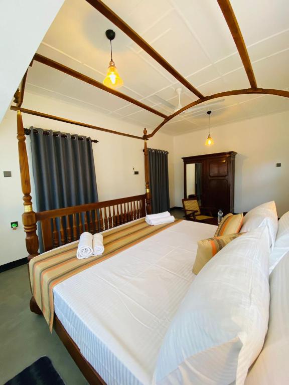 Postel nebo postele na pokoji v ubytování Happy Valley Residence Unawatuna