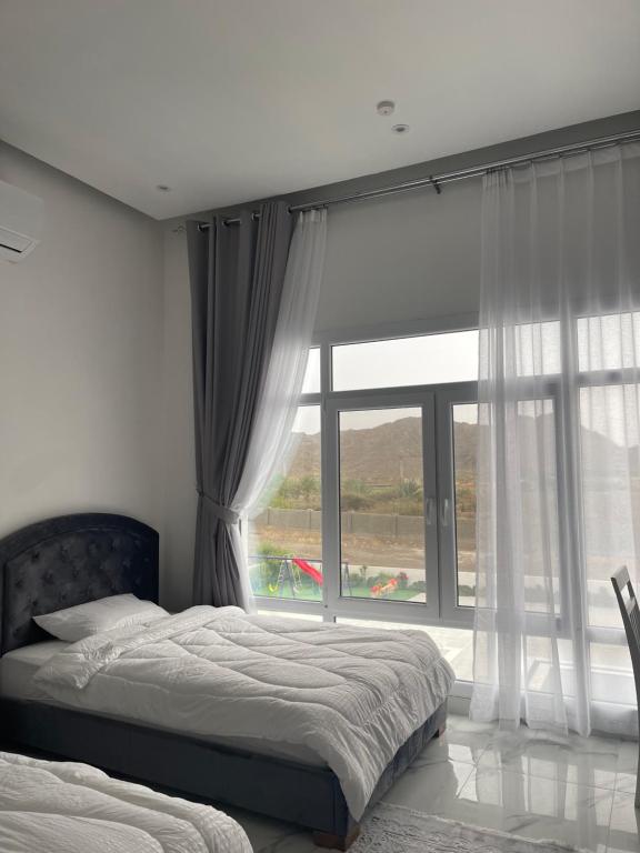 Postel nebo postele na pokoji v ubytování نزل الغيم -Cloudinn