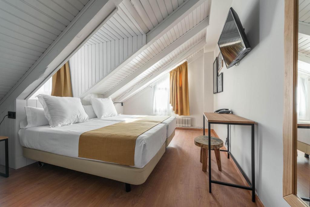 Postel nebo postele na pokoji v ubytování Hotel Viella