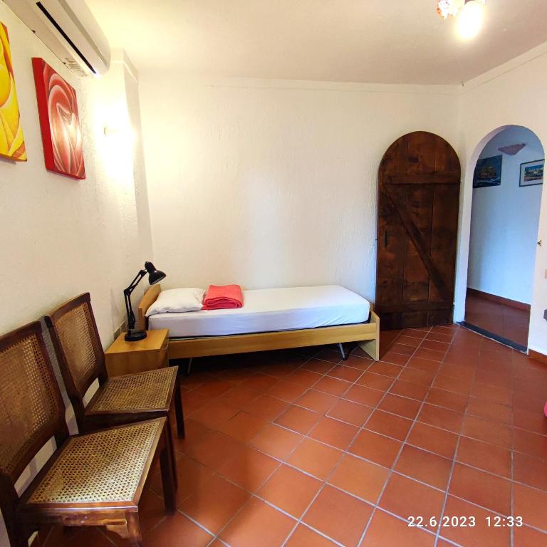 A bed or beds in a room at Villa Berio Quattro - Miguel