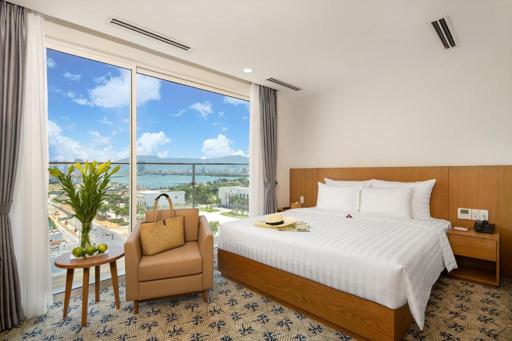 Postel nebo postele na pokoji v ubytování Lamanga Hotel & Suites