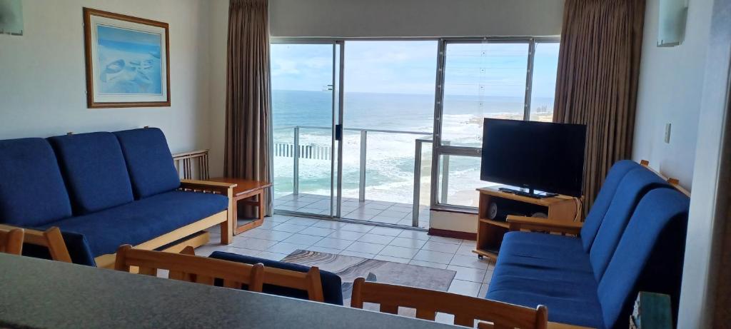 a living room with a view of the ocean at Santana Holiday Resort 1002 in Margate