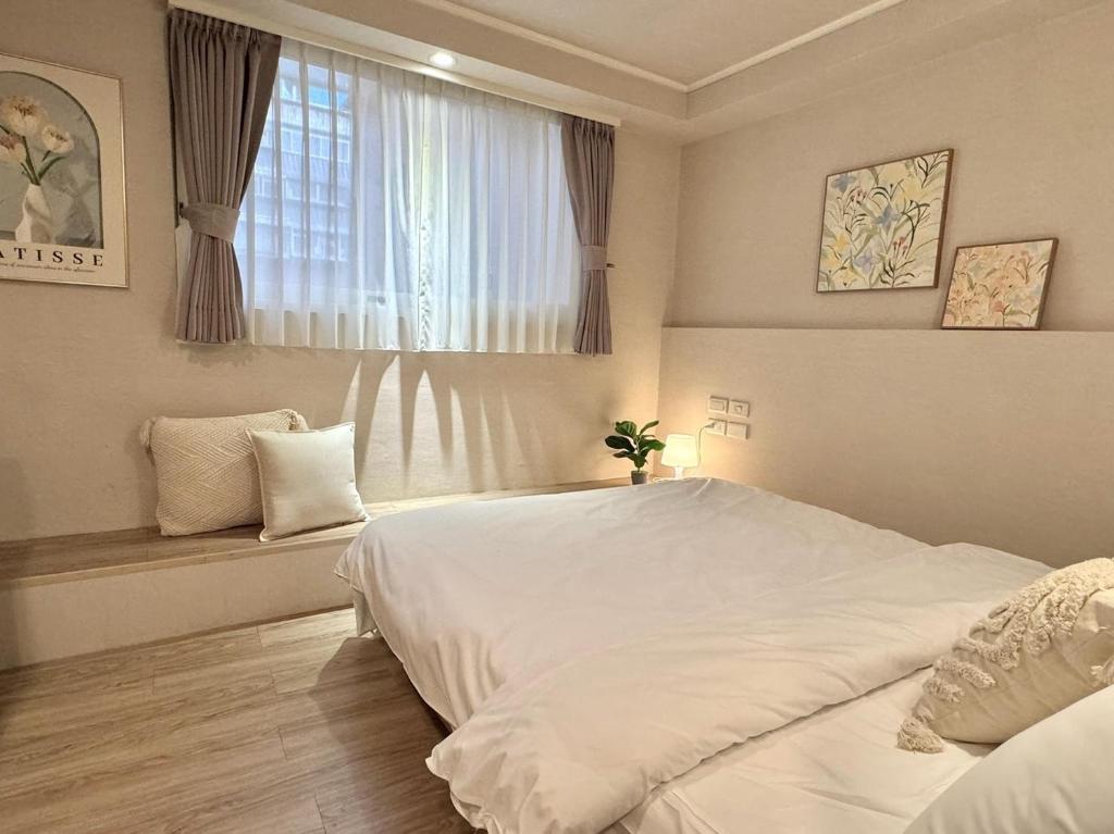 Postel nebo postele na pokoji v ubytování Meworld Hotel - Zhongshan