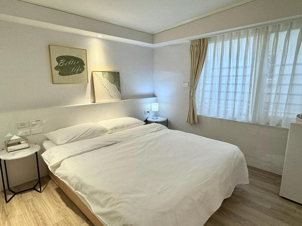 Postel nebo postele na pokoji v ubytování Meworld Hotel - Zhongshan