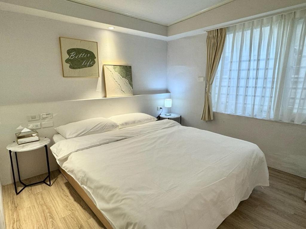 Postel nebo postele na pokoji v ubytování Meworld Hotel - Zhongshan