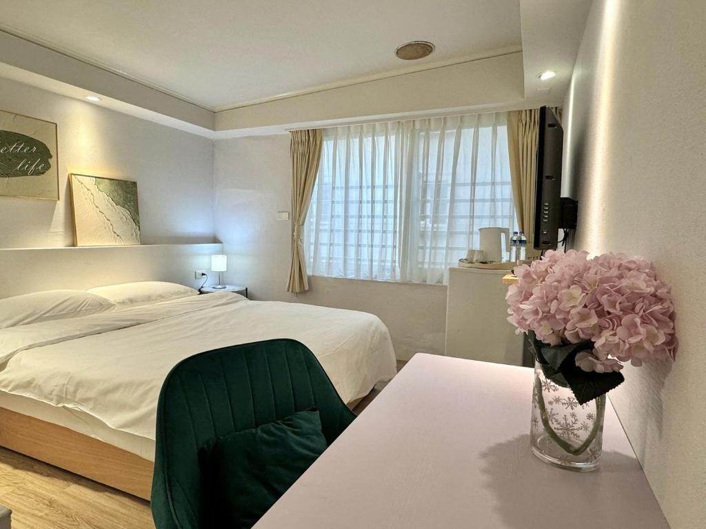 Postel nebo postele na pokoji v ubytování Meworld Hotel - Zhongshan