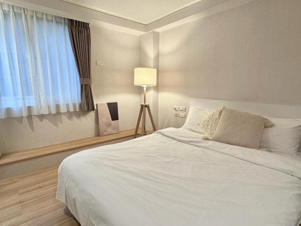Postel nebo postele na pokoji v ubytování Meworld Hotel - Zhongshan