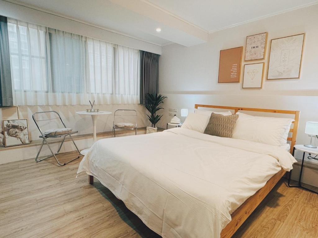 Postel nebo postele na pokoji v ubytování Meworld Hotel - Zhongshan