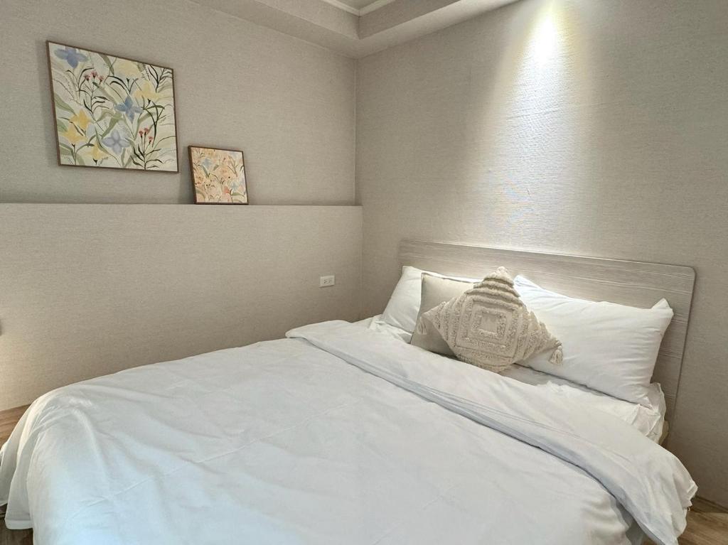 Postel nebo postele na pokoji v ubytování Meworld Hotel - Zhongshan