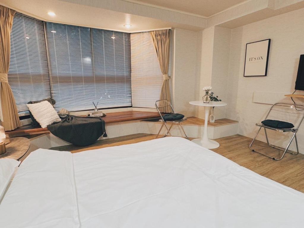 Postel nebo postele na pokoji v ubytování Meworld Hotel - Zhongshan