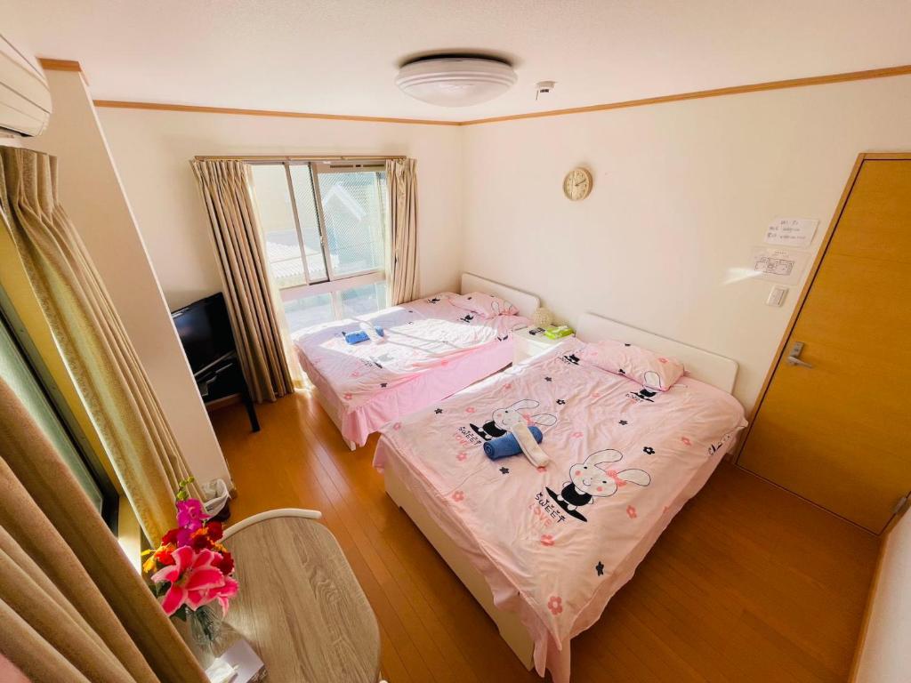 Postel nebo postele na pokoji v ubytování 糖果屋