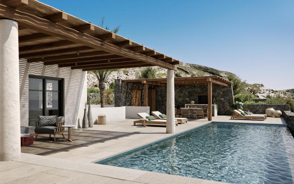 an outdoor patio with a swimming pool and a pergola at Patina Vivera Estate Santorini in Pirgos