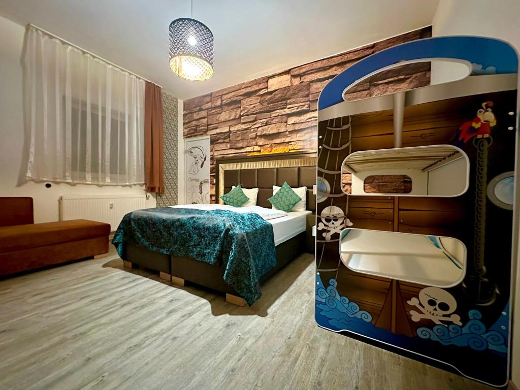 a bedroom with a pirate ship themed bunk bed at Pension Kristalpark in Günzburg