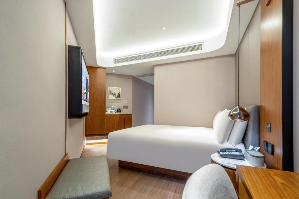 Postel nebo postele na pokoji v ubytování Atour X Hotel Shanghai Lujiazui Binjiang Avenue