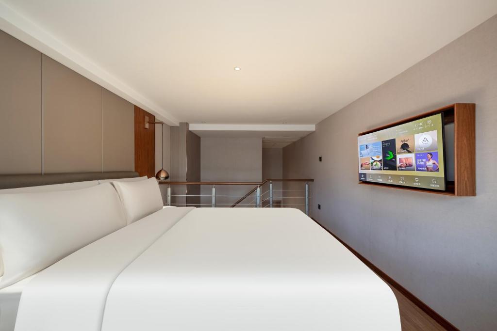 Postel nebo postele na pokoji v ubytování Atour X Hotel Shanghai Lujiazui Binjiang Avenue